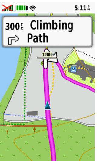 Navigation screen with a pink route on a path. Sign shows 'Climbing Path' in 300 feet. Time 5:11 PM, battery and network icons at the top.