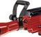 A red, electric demolition hammer with a black plastic handle and metal mounting, suitable for construction or demolition work.