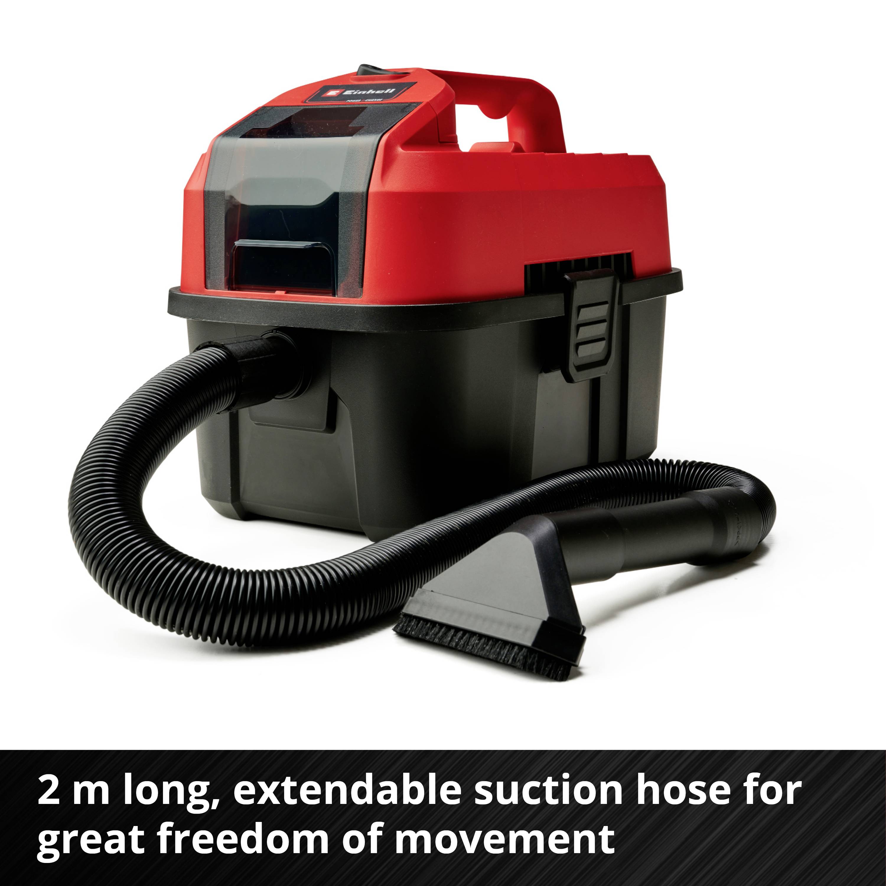 Industrial vacuum cleaner with red casing, extendable 2 m hose. Text: '2 m long, extendable suction hose for great manoeuvrability'.