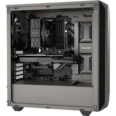 An open computer PC with visible hardware such as fans, motherboard, RAM, and power supply. The components are evenly arranged.