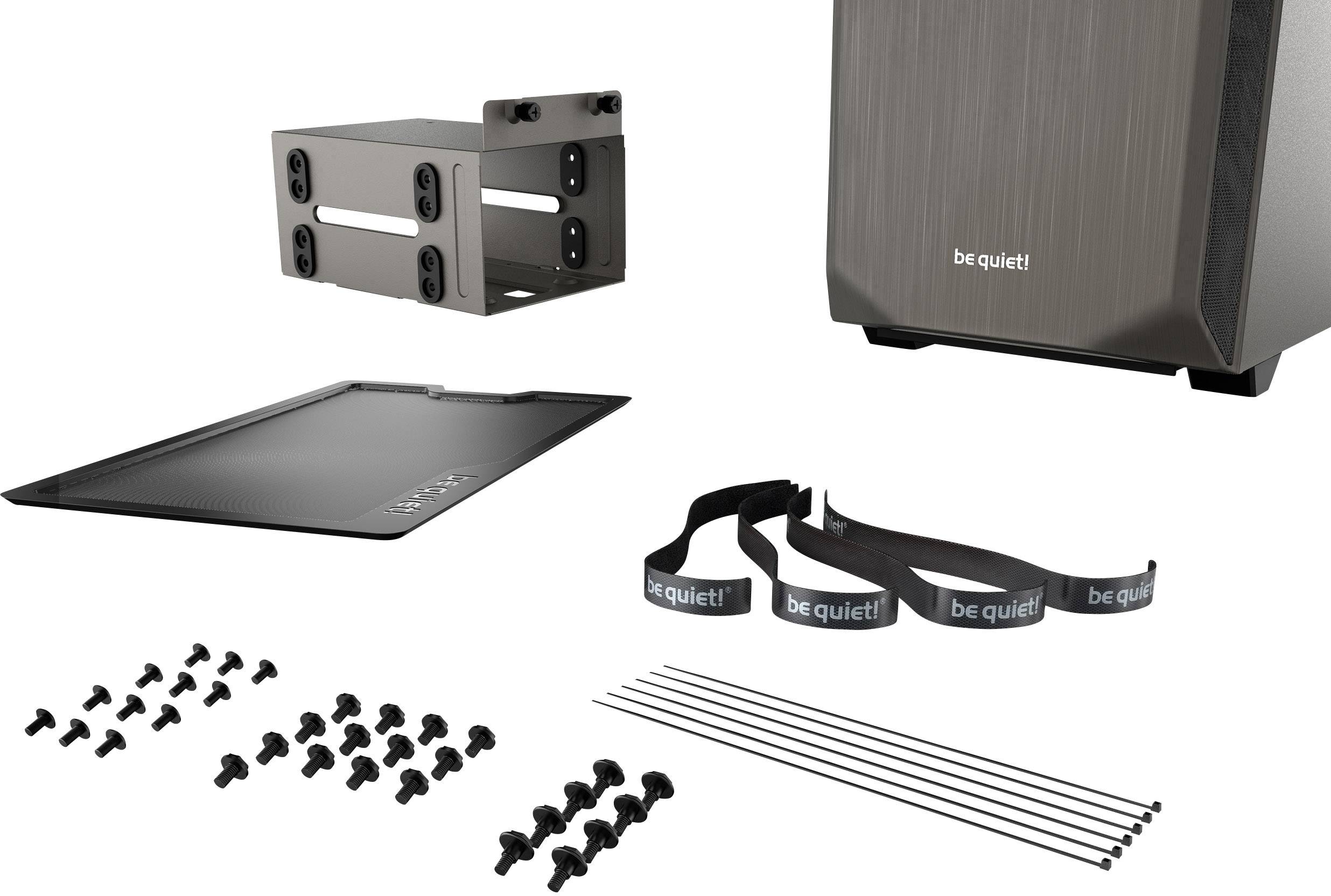 Computer case starter kit with case, hard drive bracket, screws, cable ties, and a case cover. 'be quiet!' brand name visible.