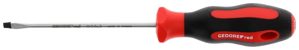 A flathead screwdriver with a red and black handle lies horizontally. The handle is ergonomically shaped, and the blade is silver-coloured.