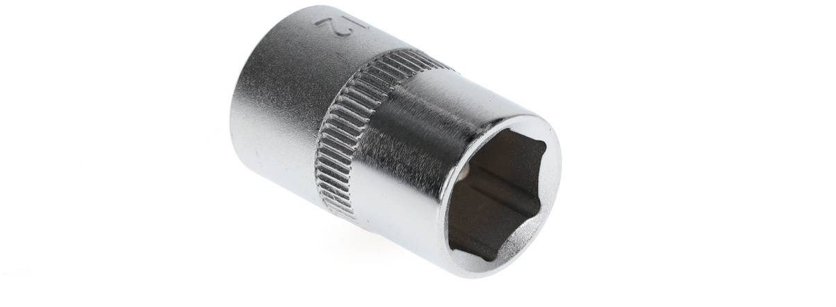 A silver socket wrench with a knurled handle and hexagonal opening lies on a white surface.
