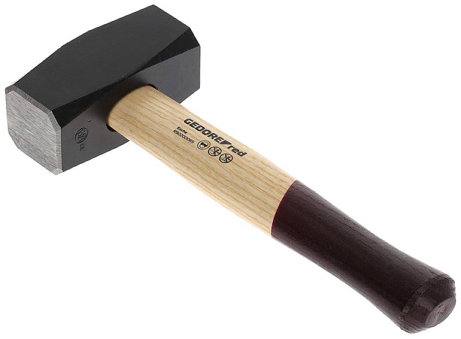 A sledgehammer with a black head and red wooden handle lies on its side.