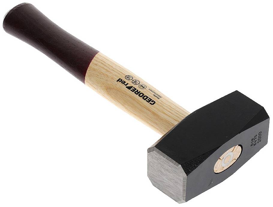 A sledgehammer with a wooden handle and a heavy, rectangular metal head. Marking on the handle.
