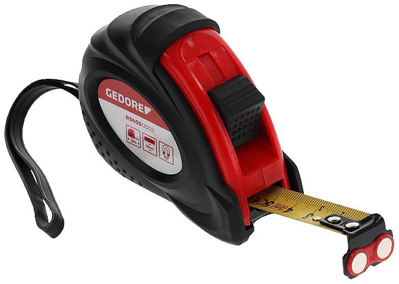 A red and black measuring tape unfurls. It is handy, fitted with a clip and a loop.