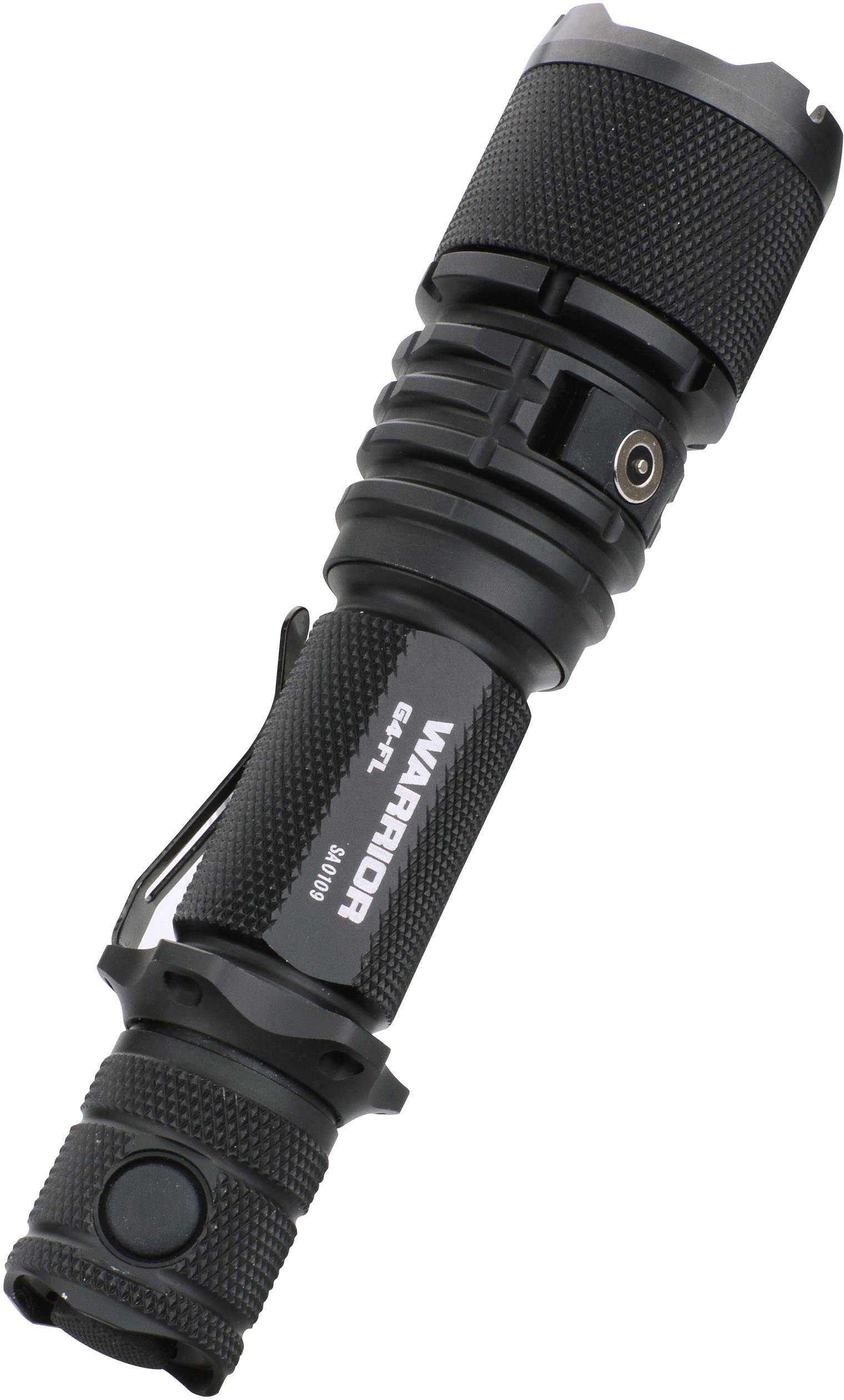 Black tactical torch with textured grip and clip, positioned at an angle. Marking on grip reads 'WARRIOR'.