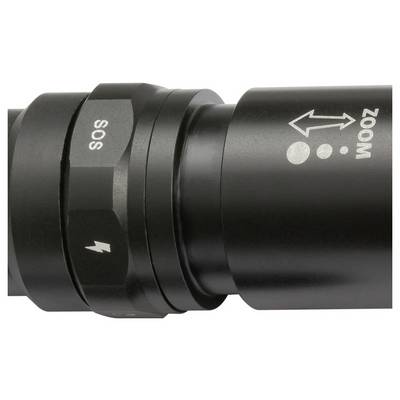 Close-up of a black flashlight head with rotating control ring labeled 'SOS', lightning symbol, and 'ZOOM' with arrow indicator.
