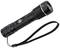 Black, cylindrical torch with hand strap, textured grip and focus lens; battery-powered design.