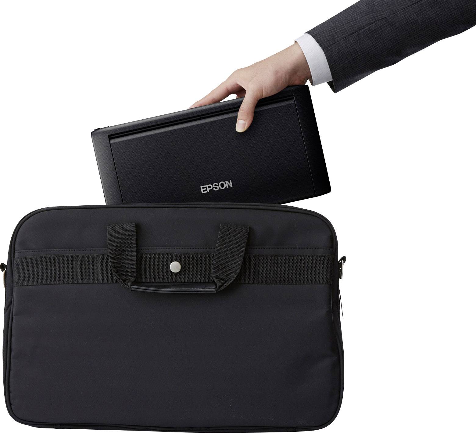 A hand places a portable Epson printer into a black carry bag.