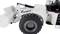 White toy digger with black and silver lettering on the wheels, showing a detailed reproduction of construction equipment.