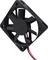 Black computer fan with seven blades and red cables, showing fan blades and electrical connection.