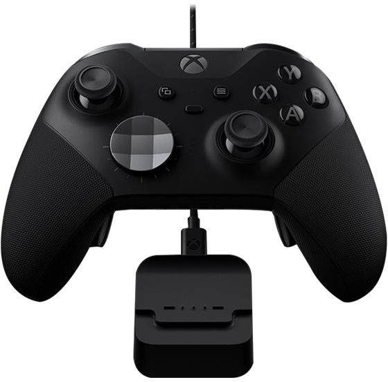 Black wired gaming controller resting on a charging station. A directional pad on the left and four action buttons on the right.