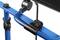 Close-up of a blue metal frame with a black rotary knob and handle. The frame is part of a rollator or similar walking aid.