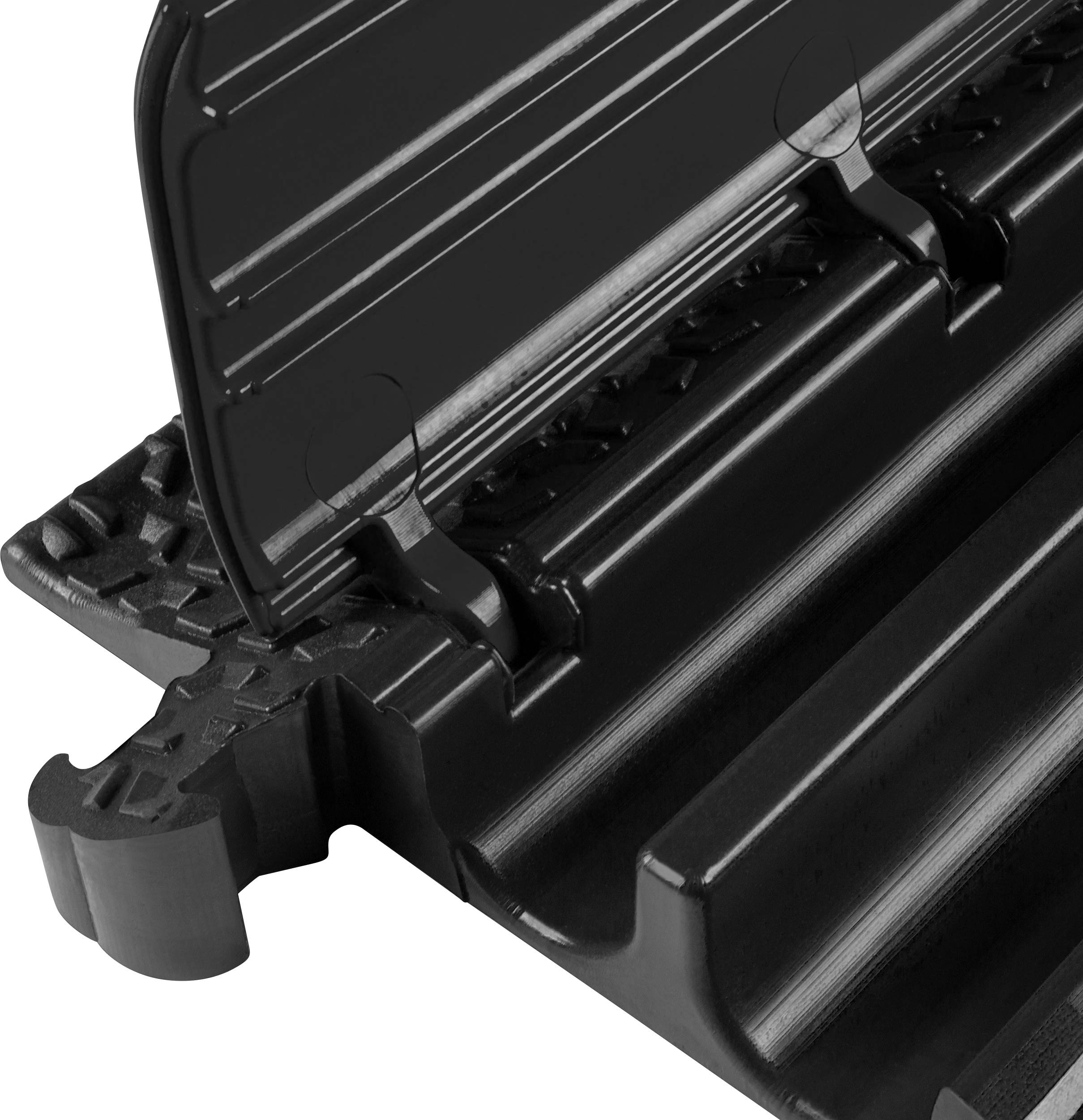 A black plastic profile with multiple grooves and raised edges, showing technical details and surface structure.