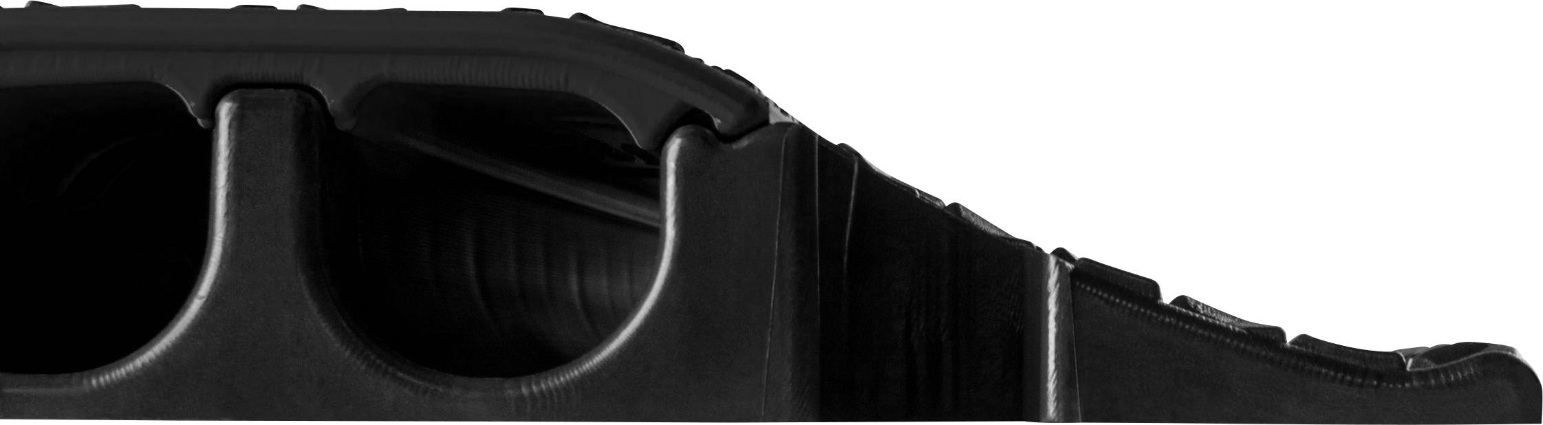 Close-up of a black, textured plastic structure with curved openings. The form appears stable and functional.