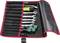 Open red and black tool bag with various spanners, torque wrench, and screwdrivers.