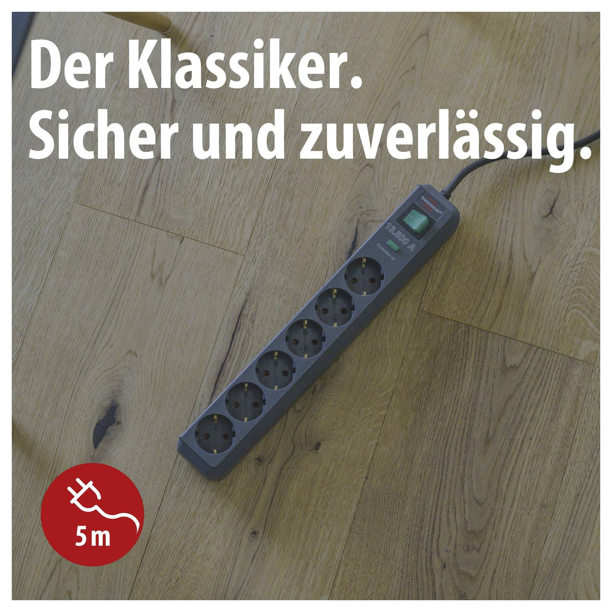 Multiple socket outlet on wooden floor with text 'The Classic. Safe and reliable.' and indication '5 m' for the cable.