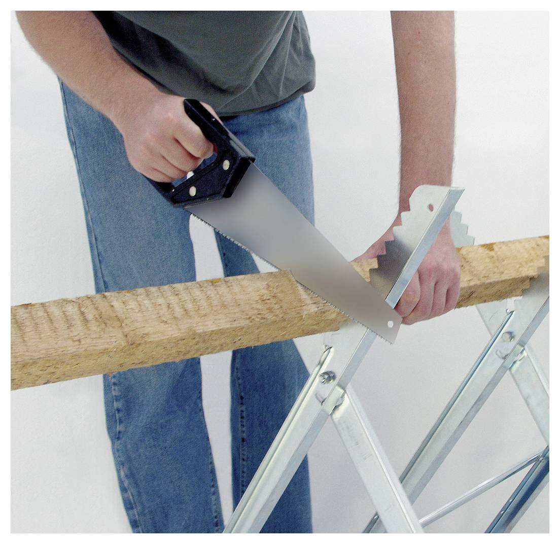 Person sawing a wooden plank on sawhorses with a hand saw<br>