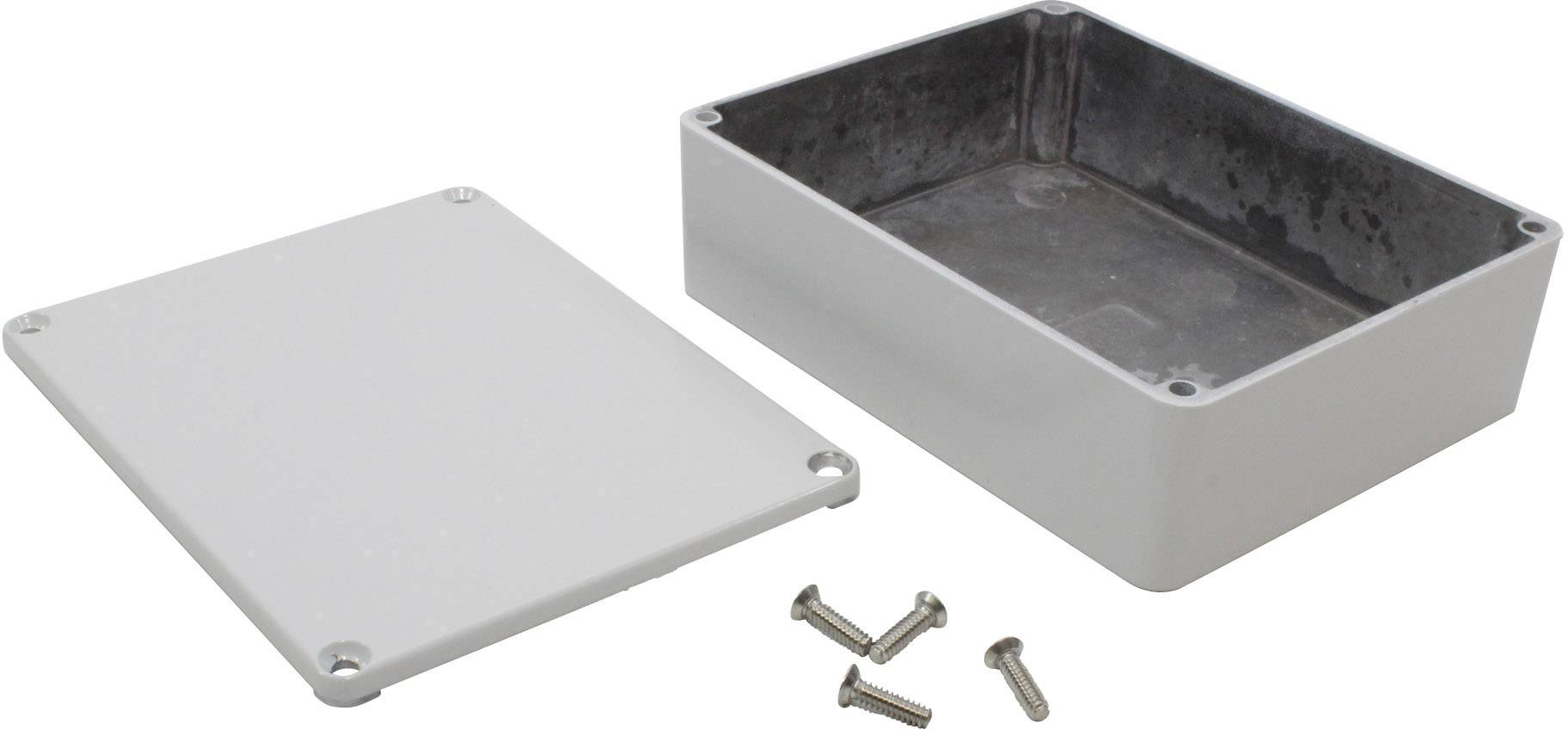 A rectangular, grey metal enclosure with a removable lid and four screws. The enclosure is open, with the lid positioned beside it.