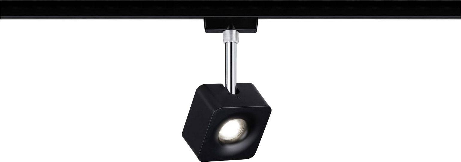 A black, square ceiling spotlight shines downwards and is mounted on a metal track.