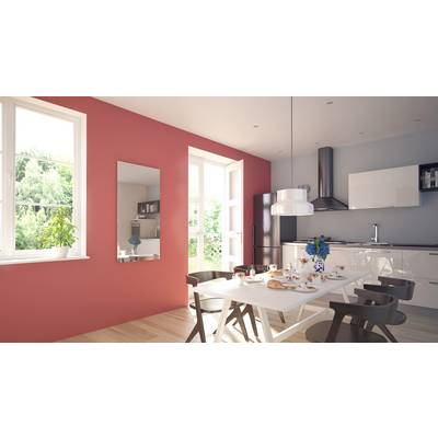 Bright dining room with a large table, set for breakfast. Modern furnishings, red wall, large windows overlooking greenery.