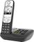 Cordless Gigaset telephone with base station, illuminated display and numeric keypad. Displays time and menu options on the screen.
