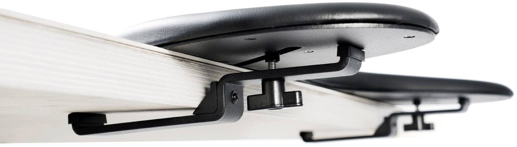Black and grey folding mechanisms mounted on a table edge, enable the folding of table tops.