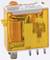 A yellow relay with technical details printed on it, showing electrical components for use in circuits or electronic systems.