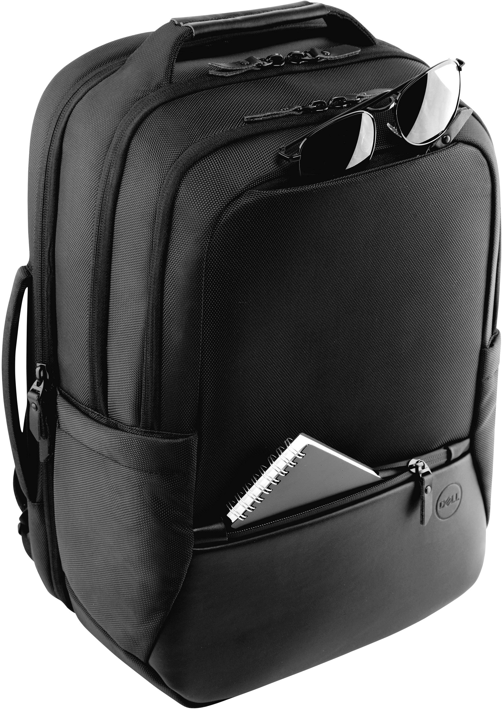 Black rucksack with multiple compartments. Sunglasses are tucked in the top section, and a notepad is protruding from the front pocket.