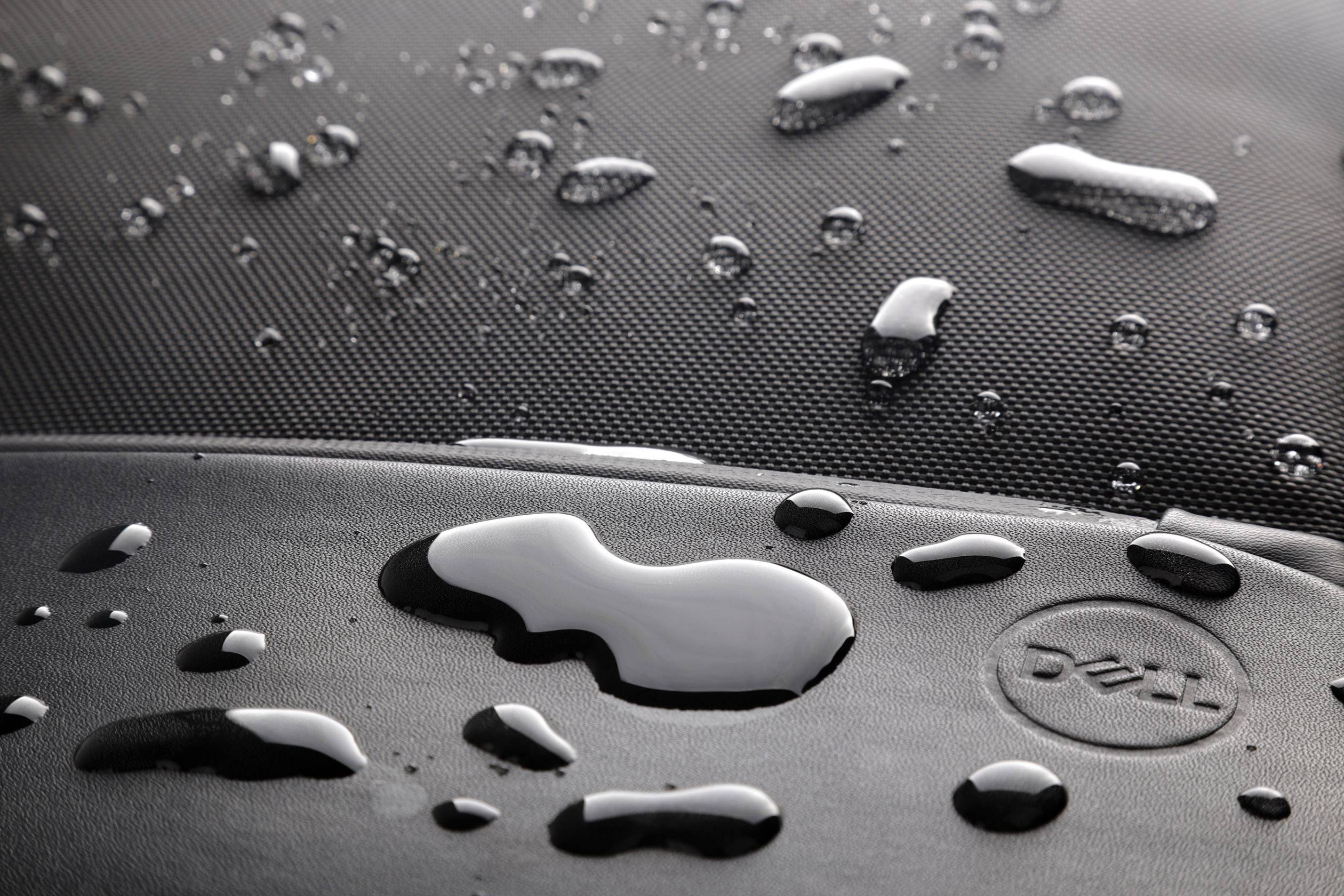 Water droplets on a dense, water-repellent surface. It demonstrates the effectiveness of the material against liquids.