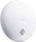 Round, white device with the 'Somfy' logo and a small grille beneath it, potentially a sensor or smoke detector.