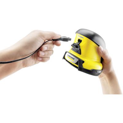 'A person connects a black cable to a yellow Kärcher device used for cleaning.'