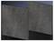 Two square, dark grey foam panels stand upright on a smooth, dark surface. The texture appears rough.