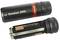 'AccuLux 200L' torch, opened, showing battery compartment. Black, cylindrical design with red accent.