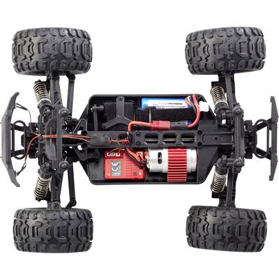 Remote-controlled car chassis, showing engine, suspension and battery compartment. Top-down view focused on technical details.