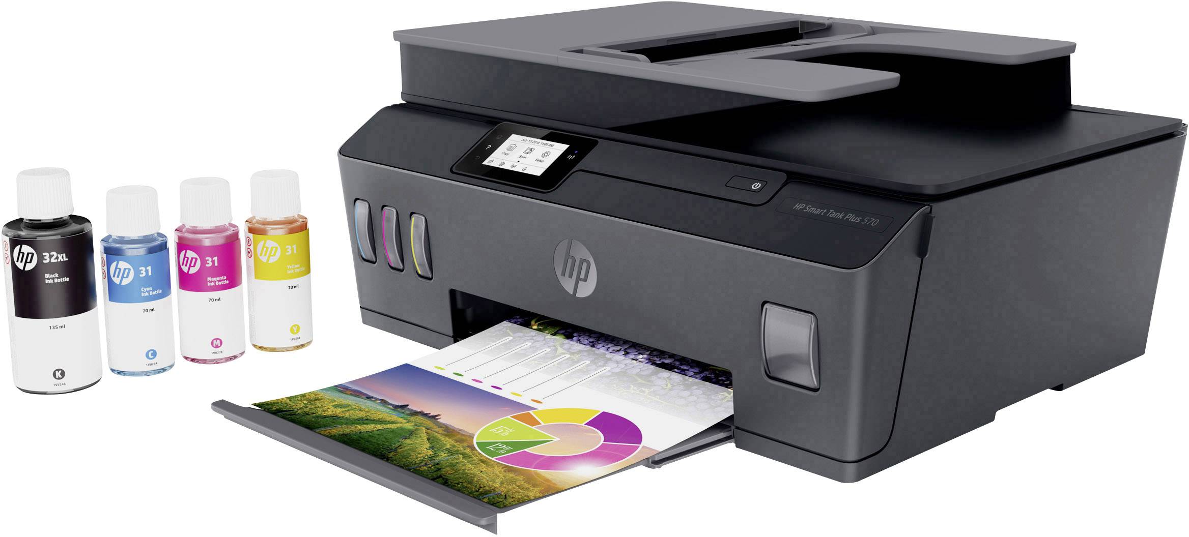 A black inkjet printer with a printed colour document and four ink bottles standing beside it.