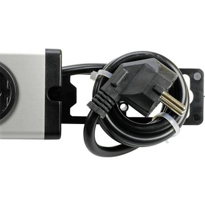 A network cable is coiled and secured with cable ties, lying next to a silver device with a plug socket.
