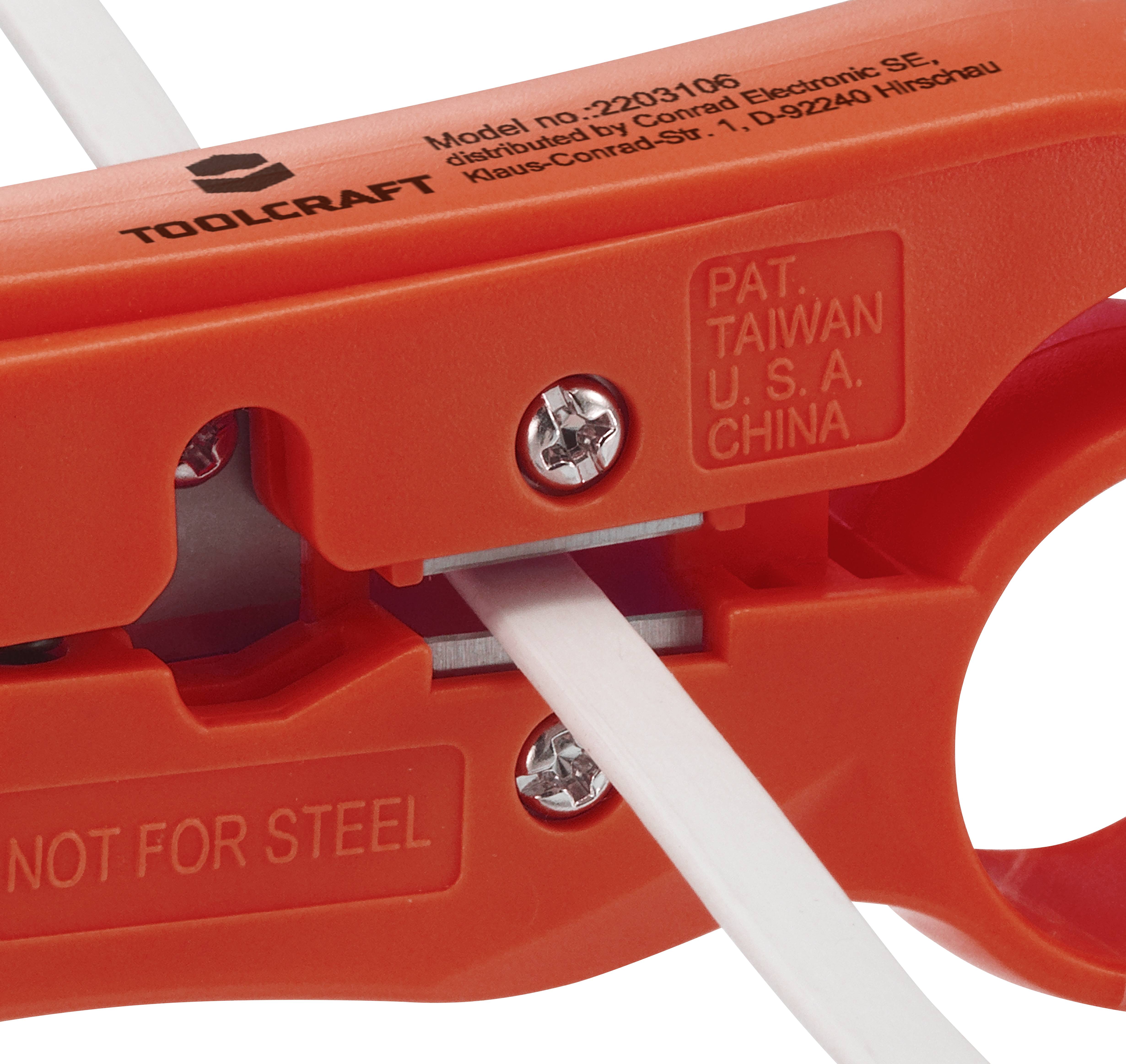 Close-up of an orange Toolcraft tool, Made in Taiwan. The tool is gripping a white cable.