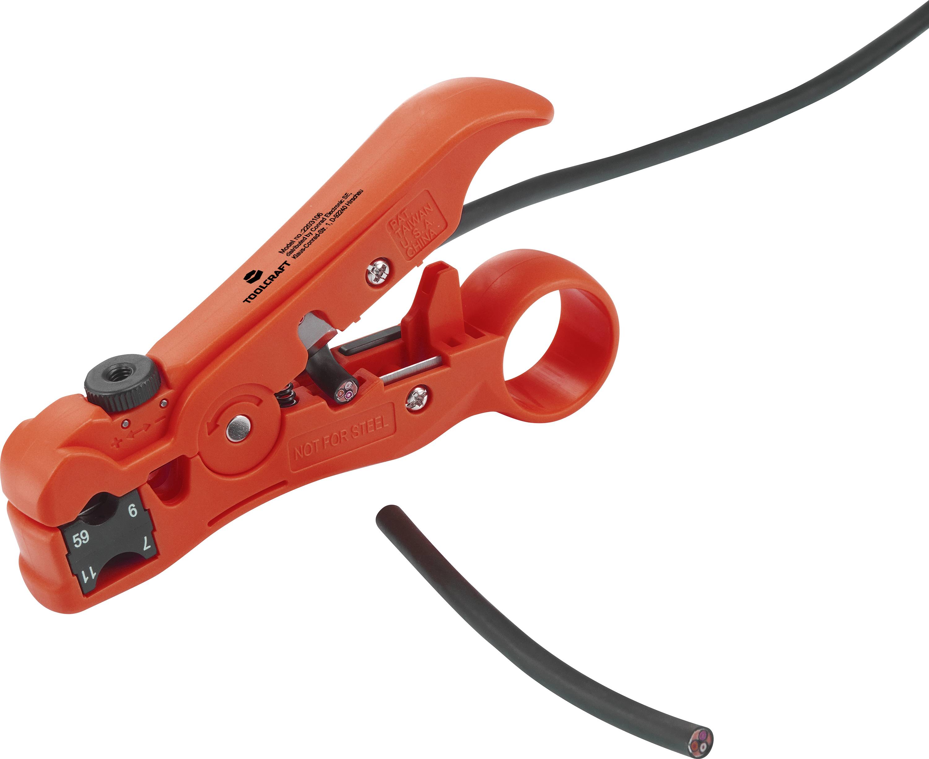 A red wire stripping tool removes the insulation from a black cable, with a section of the insulation cut away.