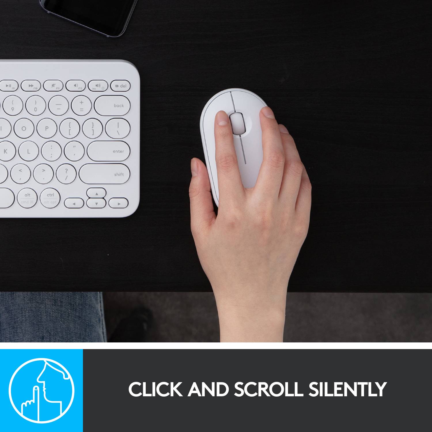 A hand uses a wireless mouse next to a keyboard. Text below: 'Quiet clicking and scrolling'.