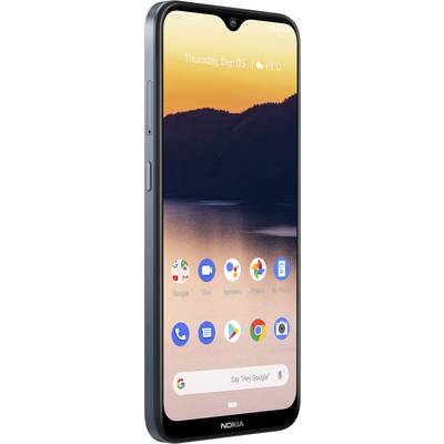 Smartphone with its display switched on; showing date and time, various app icons, and weather information; background depicts a sunset.