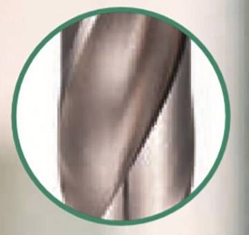 Close-up of a rotating metallic drill bit within a green circular frame.