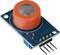 A sensor module with a round, orange housing mounted on a green circuit board. Four metal pins for electronic connections.