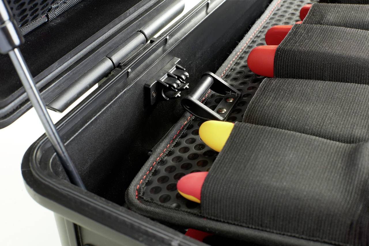 A case with a padded interior, in which several rockets with red nose cones are securely stored.