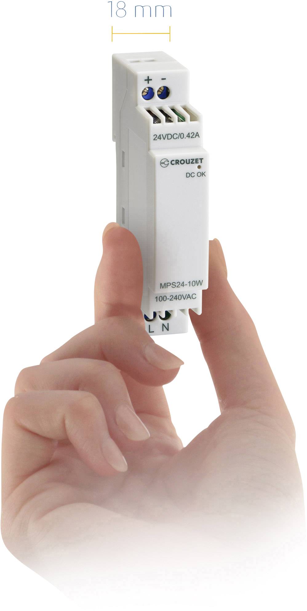 'Hand holding a compact electrical device with labelling '24VDC/DC 0.42A'. Size: 18 mm. Brand name 'Crouzet' visible. Suitable for confined spaces.'