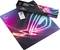 A colourful gaming mousemat with luminous line patterns and its packaged box. Text on box: 'ROG Strix Edge Gaming Mousemat'.