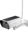 A white security camera with a solar panel and antenna, mounted on a wall bracket.