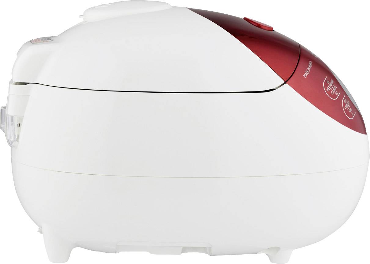 A white, oval rice cooker with a red accent. The lid is closed. Suitable for cooking rice and other dishes.