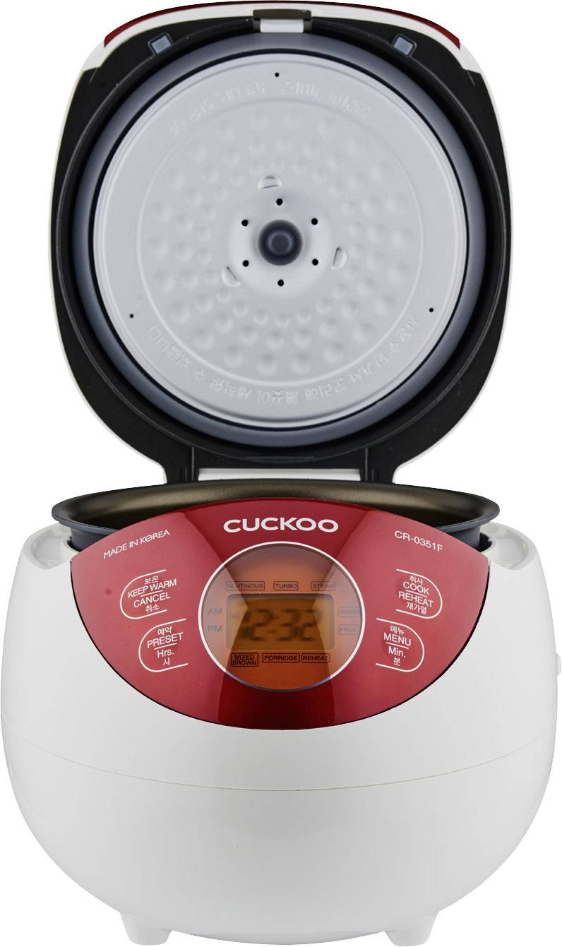 Rice cooker with lid open, showing a digital control panel on the front. The appliance is designed in white and red.